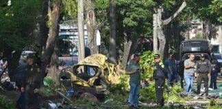 Attack on police helicopter and explosion near air base leave at least 14 dead in Colombia, officials say