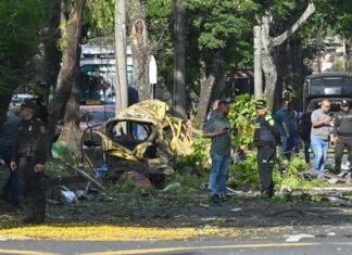 Attack on police helicopter and explosion near air base leave at least 14 dead in Colombia, officials say
