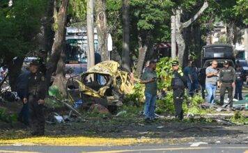 Attack on police helicopter and explosion near air base leave at least 14 dead in Colombia, officials say