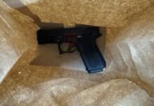 Scooter rider arrested with firearm.