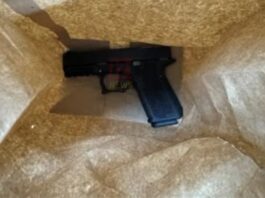 Scooter rider arrested with firearm.